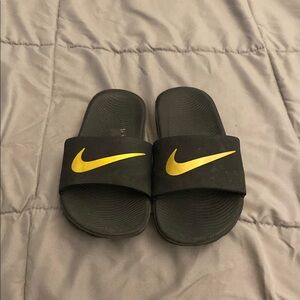Boys Nike Black and Gold Slides